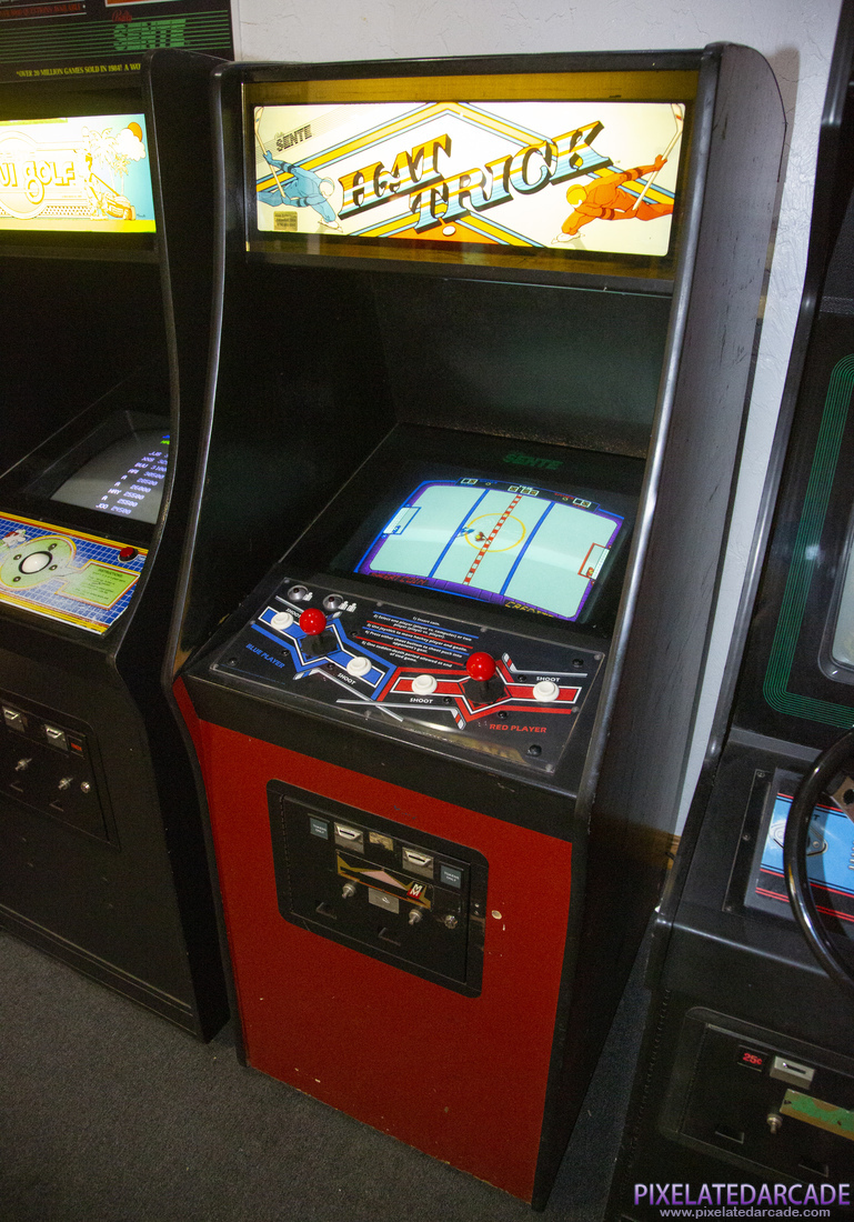 Hat Trick Photo: Hat Trick in Midway cabinet