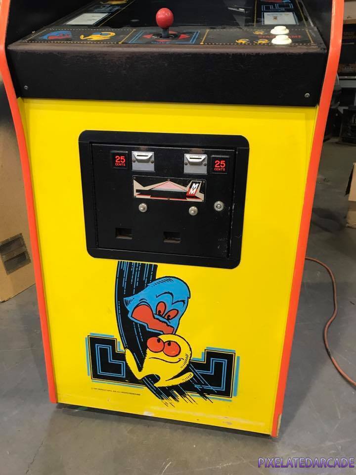 Pac-Man Photo: Pac-Man arcade cabinet coin box and front artwork