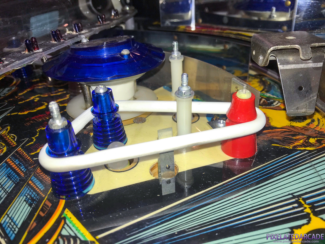 Xenon Photo: Red post in the back left of the playfield, a signature of designer Greg Kmiec.