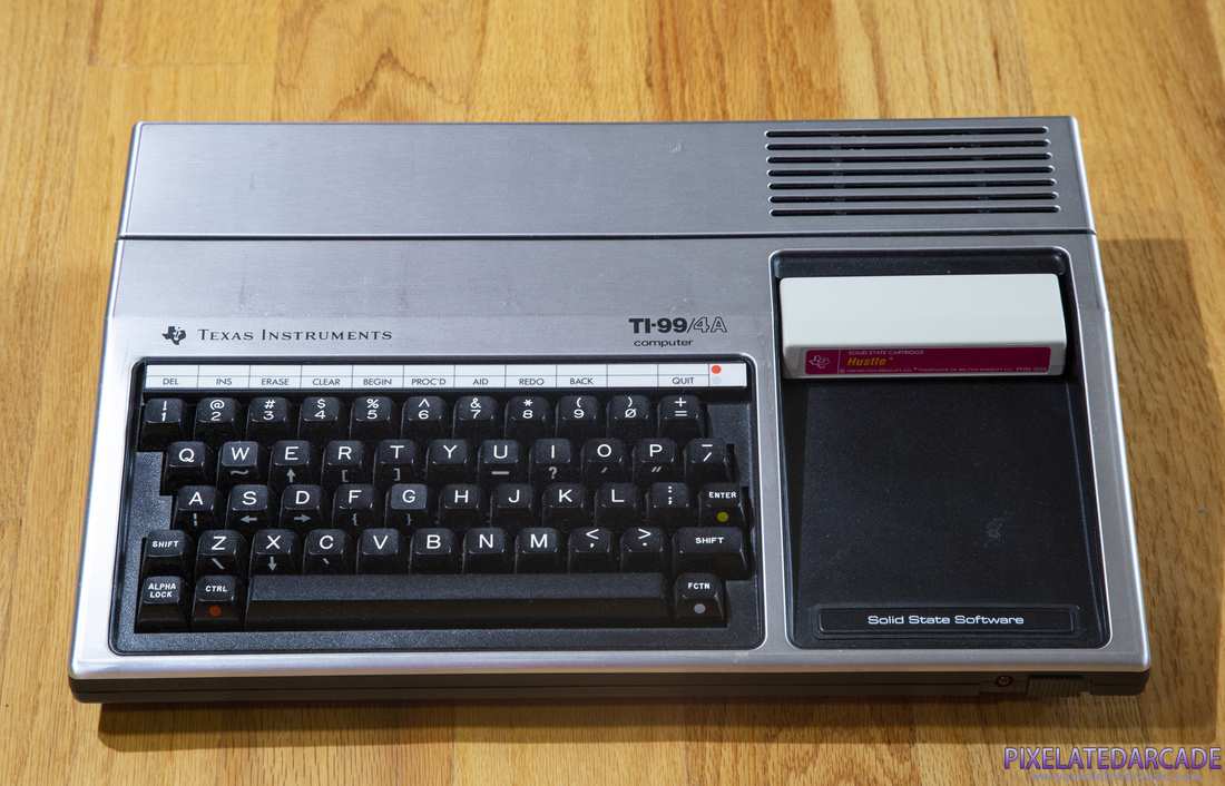 TI-99/4A Photo: TI-99/4A computer with Hustle cartridge