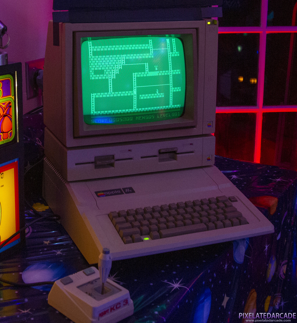Apple II Photo: Apple IIe computer with monochrome display running Lode Runner