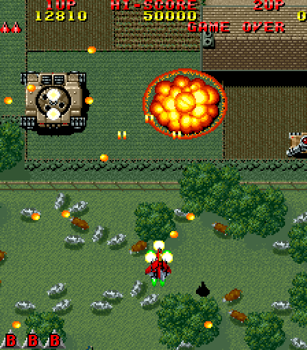 Raiden Arcade Screenshot: One large tank destroyed, but another remains...