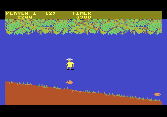 Jungle Hunt Atari 5200 Screenshot: Jumping over boulders.