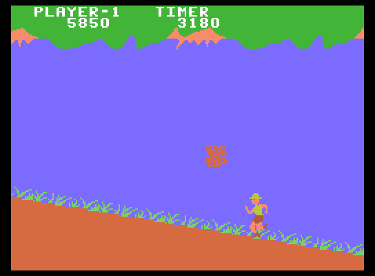 Jungle Hunt ColecoVision Screenshot: The larger boulders are more difficult to avoid.
