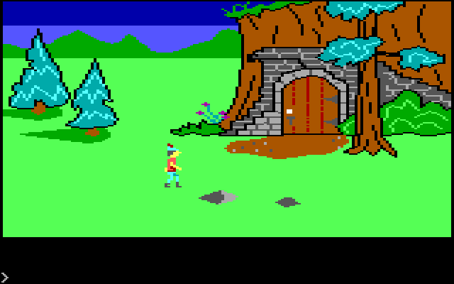 King's Quest IBM PC/Compatibles Screenshot: A door in the side of the mountain.