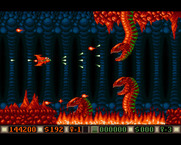 Blood Money for Amiga - Some serpents appear from the fire on this world...
