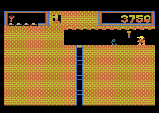 Montezuma's Revenge Atari 5200 Screenshot: Avoid the snake when trying to reach that ladder.