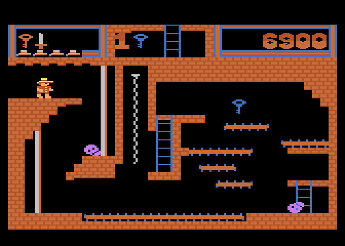 Montezuma's Revenge Atari 5200 Screenshot: Avoid the skulls when trying to get that blue key.