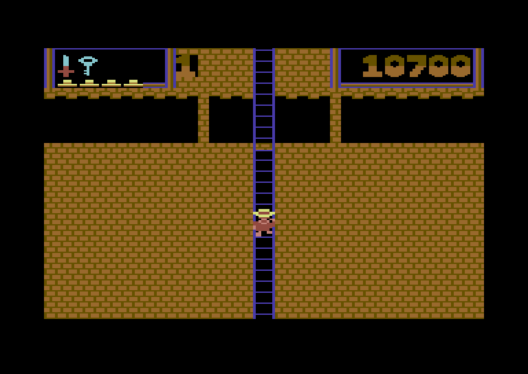 Montezuma's Revenge Commodore 64 Screenshot: Climbing down a long ladder...