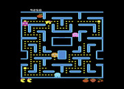 Ms. Pac-Man for Atari 7800 - A fruit appears from the upper left tunnel...