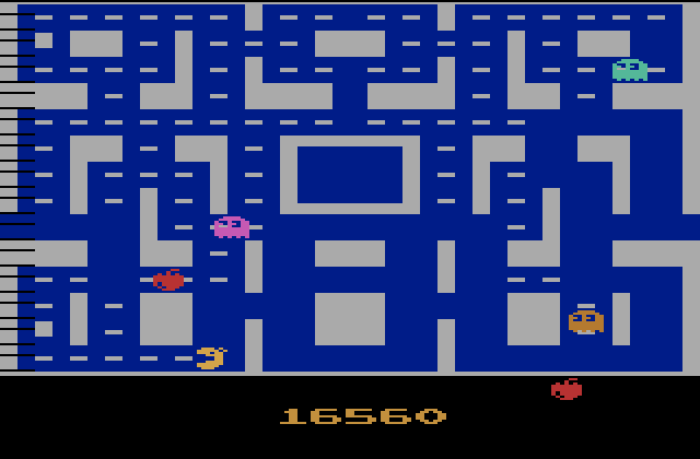 Ms. Pac-Man Atari 2600 Screenshot: The fruit bounces through the maze...
