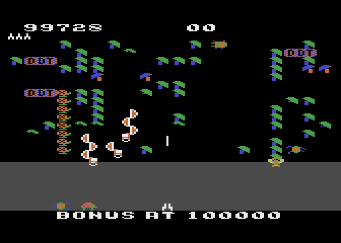 Millipede Atari 8-bit Screenshot: Millipede segments that touch a poisoned mushroom change color and head straight to the bottom of the screen.