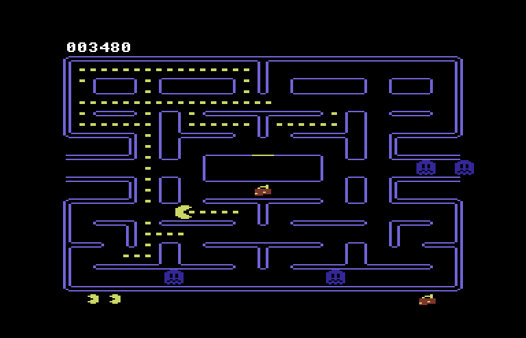 Pac-Man Commodore 64 Screenshot: The fruit in the middle of the maze is worth bonus points too...