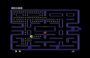 Pac-Man for Commodore 64 - The fruit in the middle of the maze is worth bonus points too...