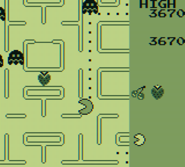 Pac-Man Game Boy Screenshot: Eat the strawberry for bonus points.