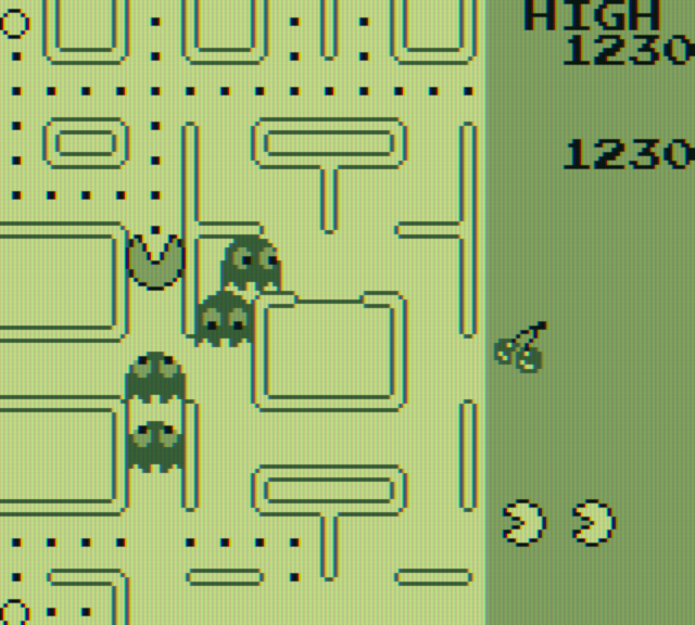 Pac-Man Game Boy Screenshot: Racing through the maze with ghosts in pursuit.