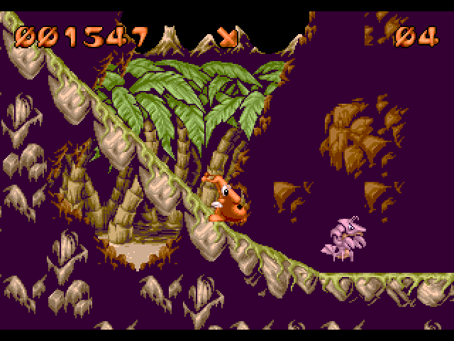 Puggsy Amiga Screenshot: Sliding down a ramp.