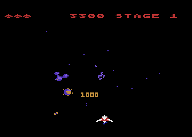 Gyruss Atari 8-bit Screenshot: 1000 points for shooting one of these satelites!