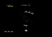Gyruss for Commodore 64 - Shooting enemies on the chance stage.