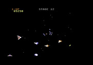 Gyruss for Commodore 64 - Each set of stages between planets has a different enemy plane formation.