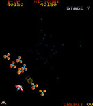 Gyruss for Arcade - Earning bonus points in the chance stage.