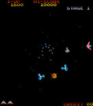 Gyruss for Arcade - Shoot the middle satelite to increase your firepower.