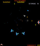 Gyruss for Arcade - Incoming enemy fire, better move quickly!