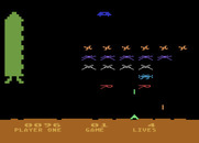 Space Invaders for Atari 8-bit - Shoot the flying saucer for bonus points.