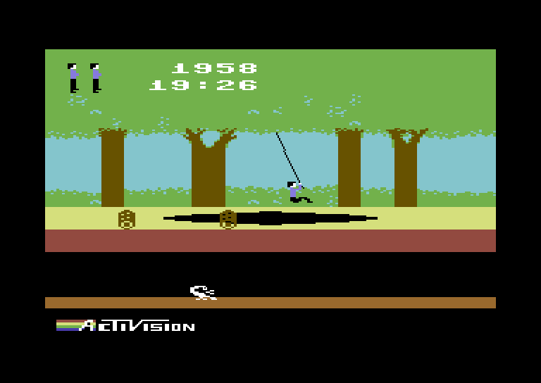 Pitfall! Commodore 64 Screenshot: Swinging over a pit.
