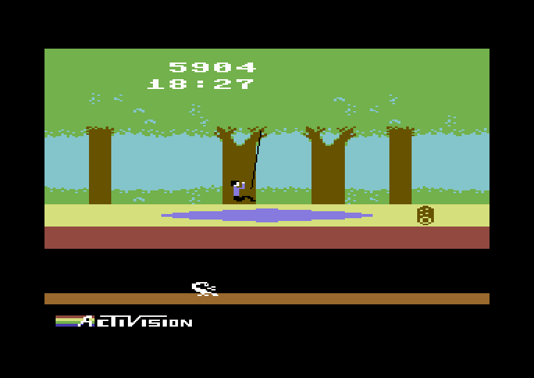 Pitfall! Commodore 64 Screenshot: Swinging over a swamp.