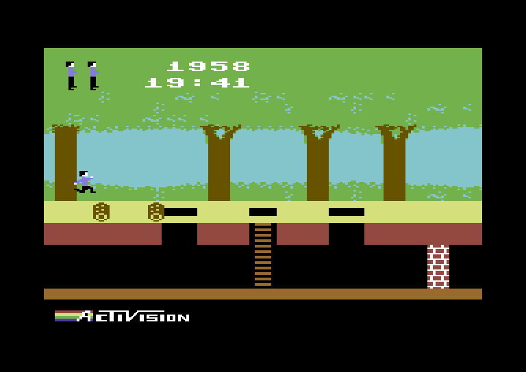 Pitfall! Commodore 64 Screenshot: Jumping over some rolling logs.