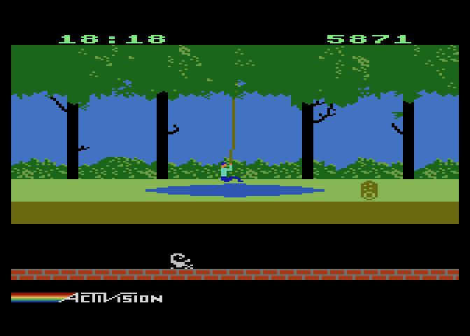 Pitfall! Atari 5200 Screenshot: Swinging over a swamp.
