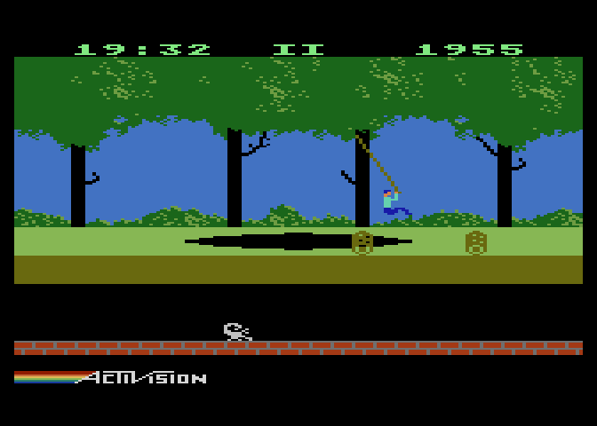 Pitfall! Atari 5200 Screenshot: Swinging on a vine over a pit.