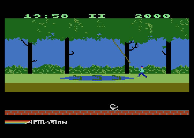 Pitfall! Atari 5200 Screenshot: You can cross swamps by jumping on crocodiles or swinging on vines.