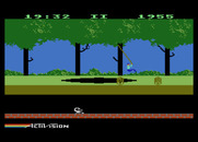 Pitfall! for Atari 5200 - Swinging on a vine over a pit.