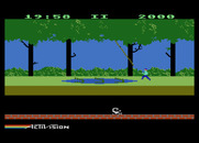 Pitfall! for Atari 5200 - You can cross swamps by jumping on crocodiles or swinging on vines.