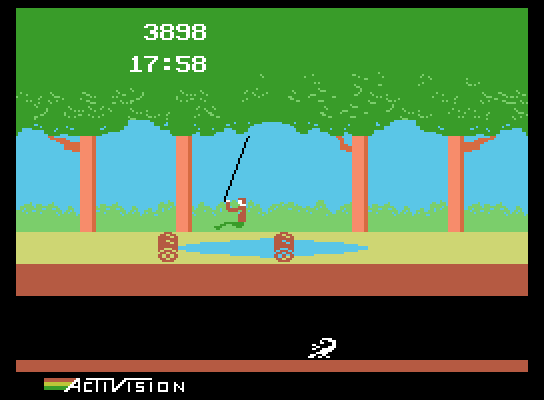 Pitfall! ColecoVision Screenshot: Swinging across the swamp...