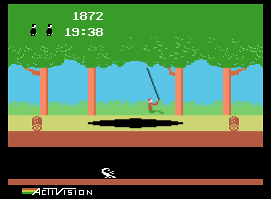 Pitfall! ColecoVision Screenshot: Swinging across a pit.