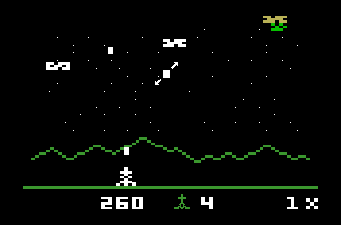 Astrosmash Mattel Aquarius Screenshot: Make sure you shoot the spinners before they hit the bottom of the screen!
