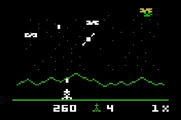 Astrosmash for Mattel Aquarius - Make sure you shoot the spinners before they hit the bottom of the screen!