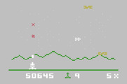Astrosmash for Mattel Aquarius - Blasting away; opponents move faster and in more varied directions now.
