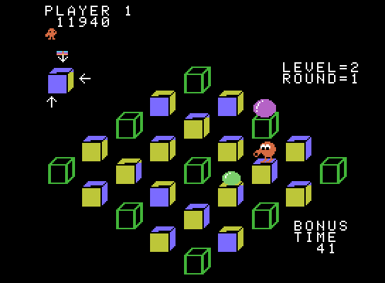 Q*bert's Qubes ColecoVision Screenshot: Capture the green ball to temporarily freeze enemies.