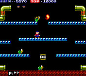 Mario Bros. for Arcade - You can kick the pests when they are upside down.