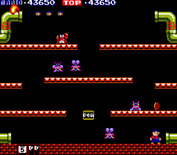 Mario Bros. for Arcade - One opponent flipped over, now run to kick it off of the platform!