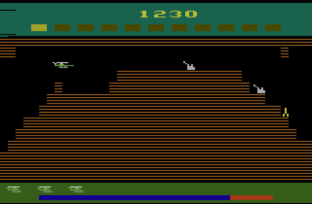 Super Cobra Atari 2600 Screenshot: These guns don't fire at you on the first level...but they will soon!