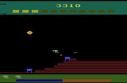 Super Cobra for Atari 2600 - Bomb the blue fuel tanks to replenish your fuel.
