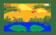 Frog Bog for Intellivision - Frogs leaping against a setting sun.