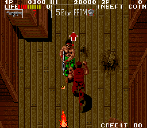 Ikari III: The Rescue Arcade Screenshot: Arrows often indicate which direction to head next...