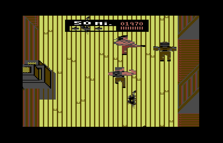 Ikari III: The Rescue Commodore 64 Screenshot: Attempting to kick an opponent...