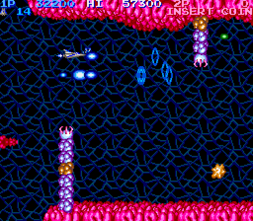 Life Force Arcade Screenshot: Shoot the orange segment of those giants hands to destroy them.